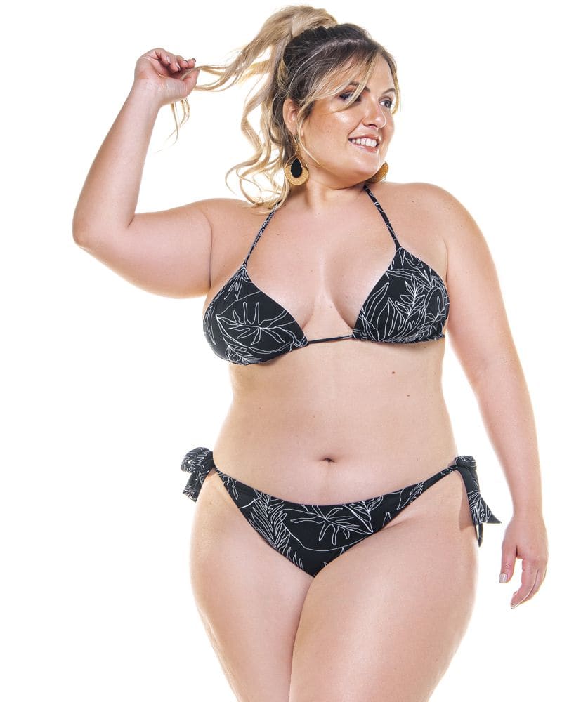 Front of a model wearing a size 18 Tied Up Swim Bottom in black and white floral by Lehona. | dia_product_style_image_id:267946